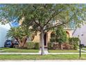 Lovely home exterior featuring lush landscaping and a welcoming entrance at 32717 Coldwater Creek Loop, Wesley Chapel, FL 33545