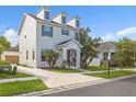 A two-story home with a well-maintained lawn and a spacious driveway and garage at 5254 Suncatcher Dr, Wesley Chapel, FL 33545