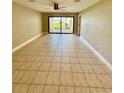 Large living area with tile flooring and sliding glass doors to the outside at 7310 Sunshine Skyway S Ln # 116, St Petersburg, FL 33711