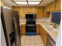 Kitchen featuring stainless steel appliances and ample cabinet space at 1122 Montrose Pl # 1713, Dunedin, FL 34698