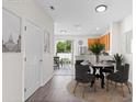 Cozy dining area next to the kitchen and patio doors at 11622 Colony Lake Dr, Tampa, FL 33635