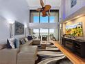 Comfortable living room with ocean views, floor-to-ceiling windows and sleek furnishings at 19700 Gulf Blvd # 204, Indian Shores, FL 33785