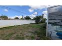 View of the backyard showing its fence and the home's outdoor pool at 249 Malvern Dr, Venice, FL 34293