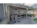 The home has a covered outdoor patio space with room for seating at 249 Malvern Dr, Venice, FL 34293