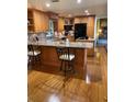 The kitchen features granite countertops, wood cabinets, and stainless steel appliances at 4713 9Th E St, Ellenton, FL 34222