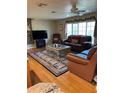 Cozy living room with hardwood floors, decorative rug, and a leather sofa set at 4713 9Th E St, Ellenton, FL 34222