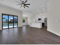 Spacious living room featuring an open floor plan and large glass doors to the outdoor pool at 9573 Migue Cir, Port Charlotte, FL 33981