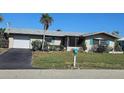 Well-maintained home with a neat front yard, driveway, and mailbox, creating a welcoming curb appeal at 134 Gulfview Rd, Punta Gorda, FL 33950