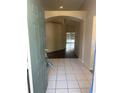 Inviting foyer featuring tiled flooring and an open archway leading to the rest of the home at 4706 Dragon Tail Ct, Valrico, FL 33594