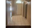 Tiled foyer leading to the front door and other areas of the home at 4706 Dragon Tail Ct, Valrico, FL 33594
