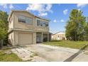 Charming two-story home with attached garage, and a spacious driveway at 6310 Cecelia Dr, New Port Richey, FL 34653