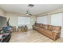 Bright living space with wood-style flooring, and comfortable seating at 6310 Cecelia Dr, New Port Richey, FL 34653