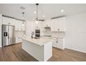 Modern kitchen featuring stainless steel appliances and a spacious island at 1775 Draughton Dr, Zephyrhills, FL 33541