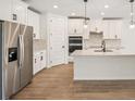 Modern kitchen featuring stainless steel appliances and a spacious island at 1775 Draughton Dr, Zephyrhills, FL 33541