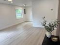 Bright and airy living room with laminate flooring and fresh paint at 38706 8Th Ave, Zephyrhills, FL 33542