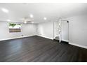 Bright, open living room with sleek, dark floors and recessed lighting, creating a modern and inviting space at 5001 S 88Th St, Tampa, FL 33619