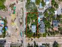 Aerial view of the property shows its boundaries and proximity to the retention pond at 226 N Grosse Ave, Tarpon Springs, FL 34689