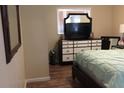 Comfortable bedroom with a dresser, mirror and a large window at 3680 Whiting Se Dr, St Petersburg, FL 33705