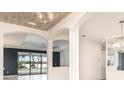 Bright foyer with white arches and views of the pool at 20323 Granlago Dr, Venice, FL 34293