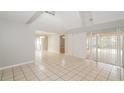 Bright and open living area with tile flooring and sliding glass doors to the patio at 1001 Meadowcrest Dr, Valrico, FL 33594