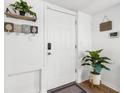 Bright entryway featuring a welcoming door, stylish decor, and a plant at 5141 Mallet Dr, Port Richey, FL 34668