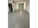 Spacious garage with sealed floor, offering ample space for parking and storage at 150 Brent Cir, Oldsmar, FL 34677