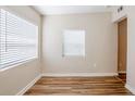 Bright bedroom featuring wood-look floors and white trim with ample natural light at 1769 Dayton S St, St Petersburg, FL 33712