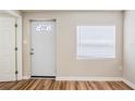Inviting entryway features wood-look floors, white trim, and a decorative glass door at 1769 Dayton S St, St Petersburg, FL 33712