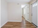 Bright living room features wood-look floors and white trim with ample natural light at 1769 Dayton S St, St Petersburg, FL 33712