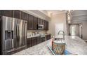 Modern kitchen featuring stainless steel appliances and granite countertops and large island at 11456 Libby Rd, Spring Hill, FL 34609