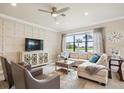 Comfortable living room featuring stylish decor, a cozy seating area, and large windows for natural light at 13084 Rinella St, Venice, FL 34293