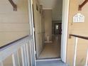 A view from the front porch into the home's entryway, showcasing tile flooring at 13 Euclid Dr, Plant City, FL 33563