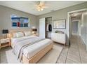 Inviting bedroom with neutral walls, a cozy bed, and a bright window view at 5629 Nutmeg Ave, Sarasota, FL 34231