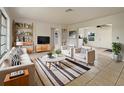 Bright living room with stylish furniture, decorative shelves, and a neutral color palette at 5629 Nutmeg Ave, Sarasota, FL 34231