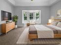 Spacious main bedroom with a bay window seating area, natural light, and neutral tones at 16006 Stags Leap Dr, Lutz, FL 33559