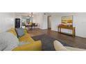 The living room features sleek wood floors, modern furniture, and plenty of natural light at 2257 World Parkway W Blvd # 61, Clearwater, FL 33763