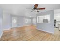 Bright living room with a ceiling fan and wood-look flooring at 2813 21St W Ave, Bradenton, FL 34205