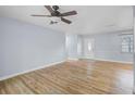 Spacious living room featuring wood-look floors and a modern ceiling fan at 2813 21St W Ave, Bradenton, FL 34205