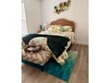 Cozy bedroom featuring a plush bed, decorative accents, and stylish decor, perfect for relaxation at 6320 Cedar St Ne, St Petersburg, FL 33702