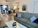 Bright and airy living room with modern furniture, seamlessly connected to the dining area and kitchen at 6320 Cedar St Ne, St Petersburg, FL 33702