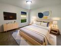 Comfortable bedroom with a large bed, modern furniture, and soft lighting at 9855 Morris Glen Way, Temple Terrace, FL 33637