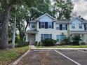 Inviting two-story townhome with well-maintained landscaping, sidewalk and parking at 2247 Golden Oak Ln, Valrico, FL 33594