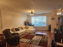 Comfortable living room with a large window, plush seating, and stylish decor at 2247 Golden Oak Ln, Valrico, FL 33594