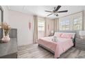 Bright bedroom featuring a comfortable bed, stylish furnishings, and soothing color palette at 4311 123Rd W St, Cortez, FL 34215