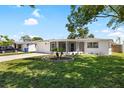 Charming home with a well-kept lawn, complete with landscaping, and a private driveway at 3410 Allandale Dr, Holiday, FL 34691