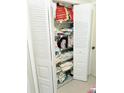 Open closet showing wire shelves with linens and pillows at 6640 121St Ave # 1, Largo, FL 33773