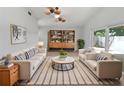 Bright living room with neutral paint, ceiling fan, and lots of natural light. Bookcase included at 10344 Rosemount Dr, Tampa, FL 33624