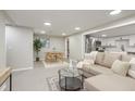 Bright living room featuring modern decor, recessed lighting, and open access to the kitchen at 709 1St Ne Ave, Largo, FL 33770