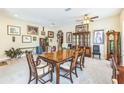 Formal dining room featuring carpeted floors, ample art, and a wooden table with seating for six at 20074 Heritage Point Dr, Tampa, FL 33647