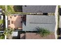 An aerial view of the backyard featuring a spacious brick patio and deck for outdoor enjoyment at 2904 Sanchez St, Tampa, FL 33605